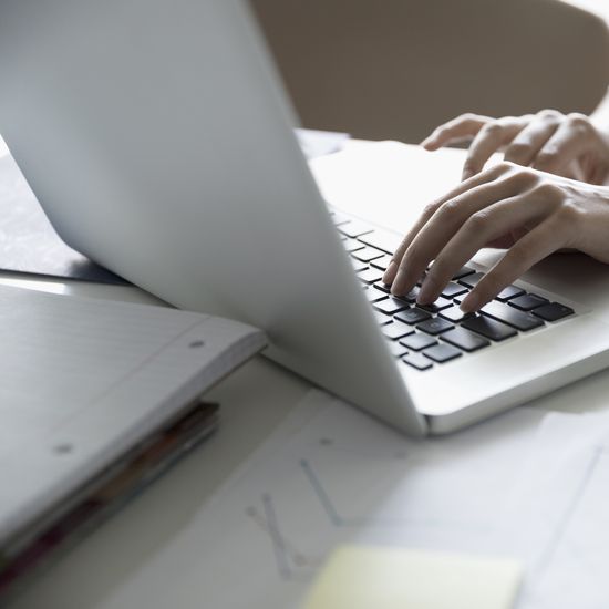 Female architect working at laptop