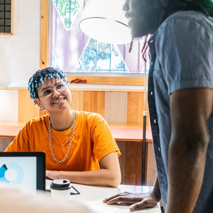 Young transgender female during business meeting at officeColorful Human