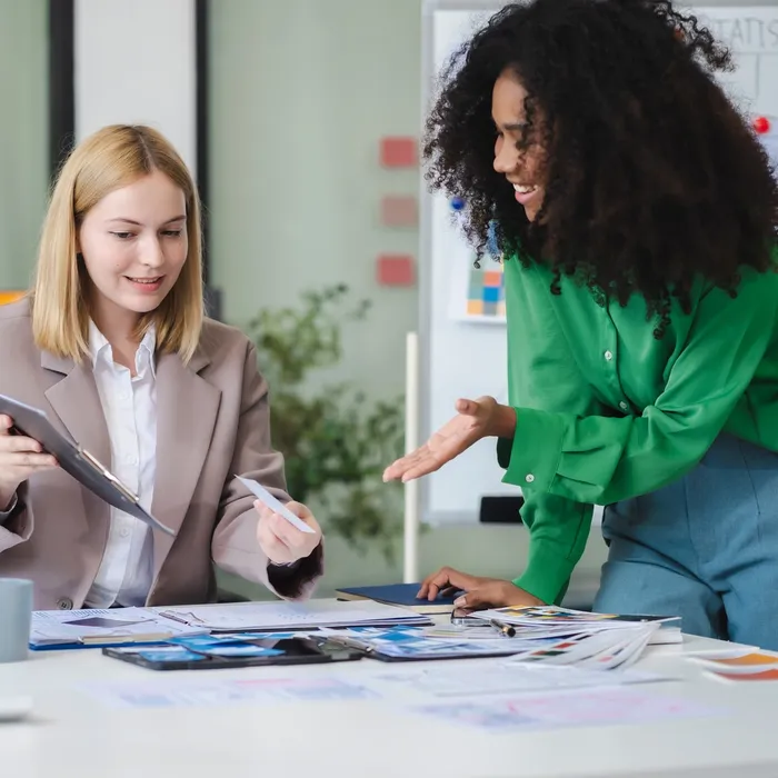 UX developer and ui designer brainstorming about mobile app interface wireframe design with customer breif and color code,