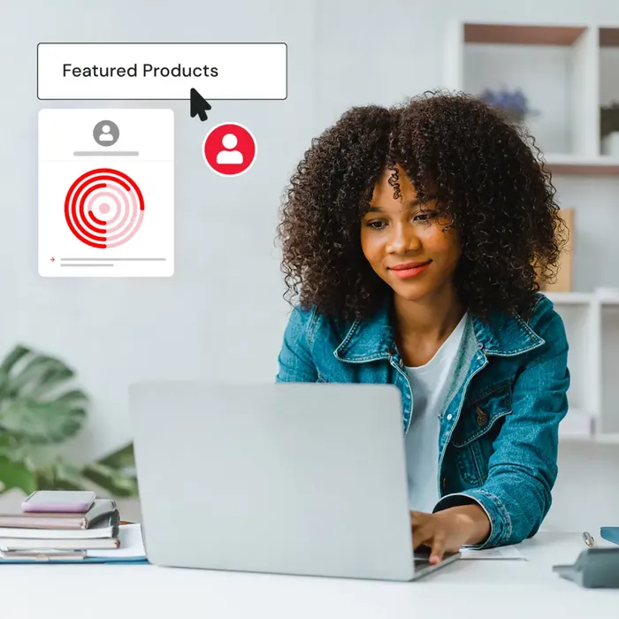 girl with lush hair works at laptop