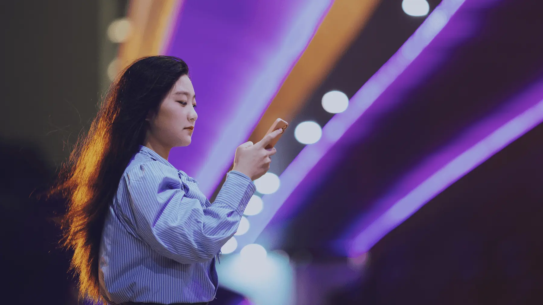 woman on phone at a platform