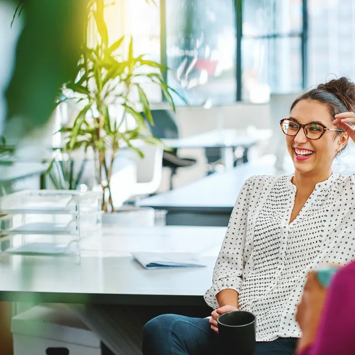 Shot of two businesswoman taking a break in an office
