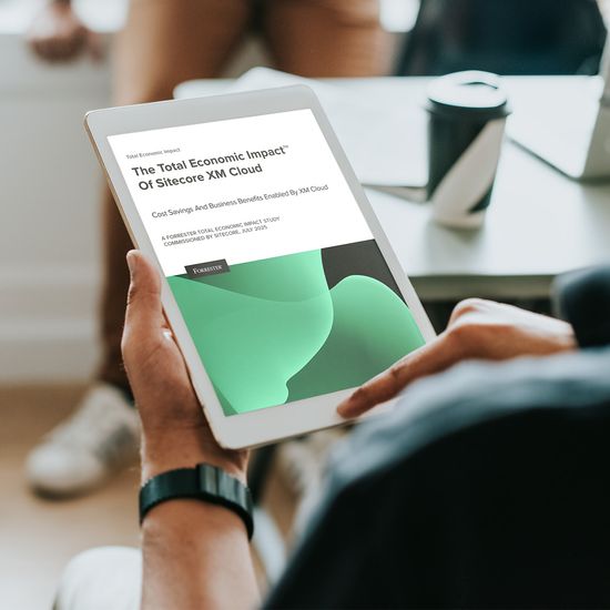 Persona holding an iPad and reading Forrester report