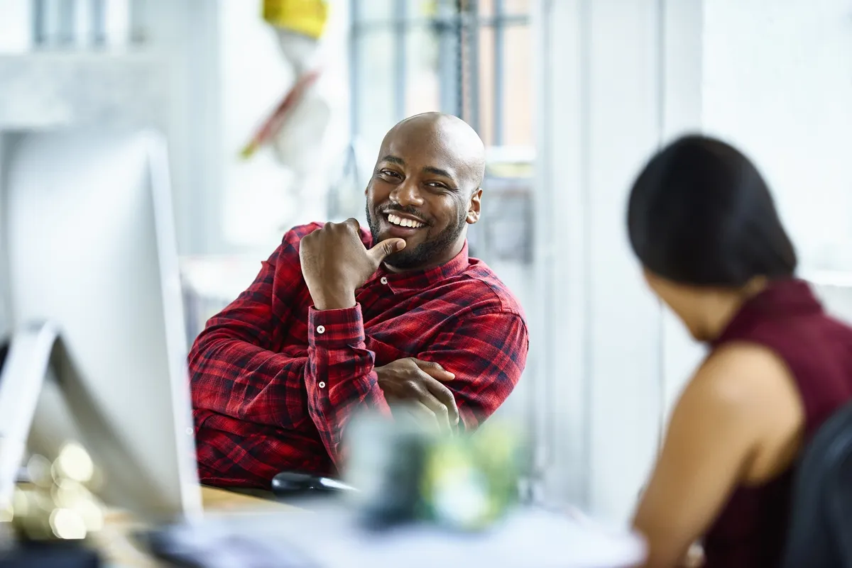 Man and woman talking in modern office