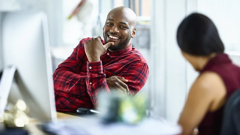 Man and woman talking in modern office