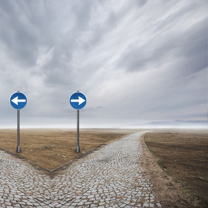 Road sign direction on desert.