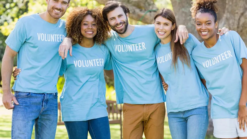 Portrait Of Volunteer Group Posing In Park