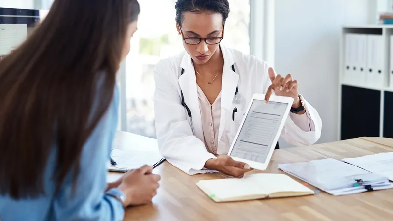 Less,Paper,,More,Patient,Feedback.,Shot,Of,A,Young,Doctor