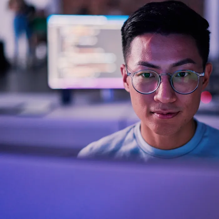 Businessman, computer or programming code in night office for software development, cybersecurity or database safety. Asian programmer, developer or engineer on technology for web 3.0 coding in darkColorful Human