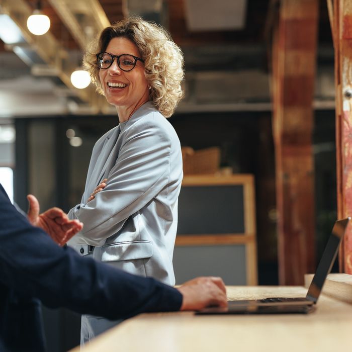 Tech,Professionals,Talking,To,Each,Other,In,A,Coworking,Office.