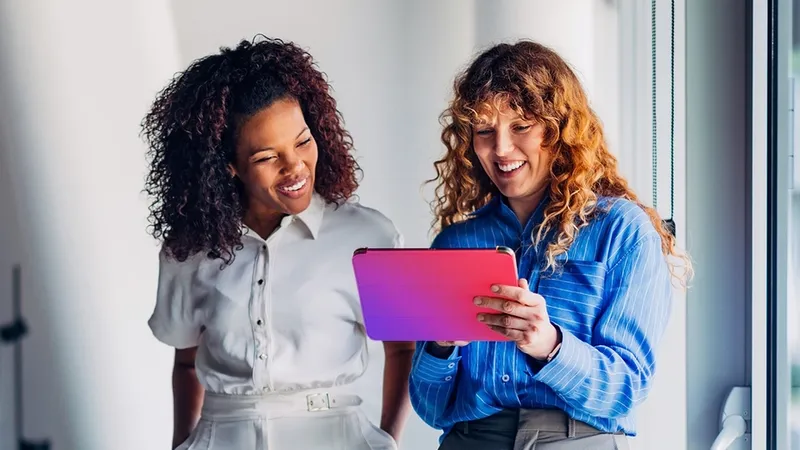 Two women with a device