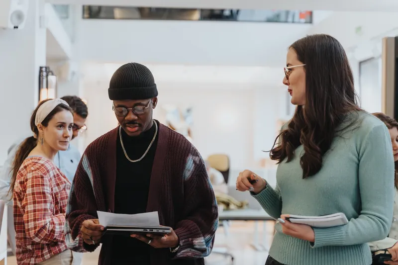 A,Focused,Multiethnic,Team,Collaborates,In,A,Brightly,Lit,Office