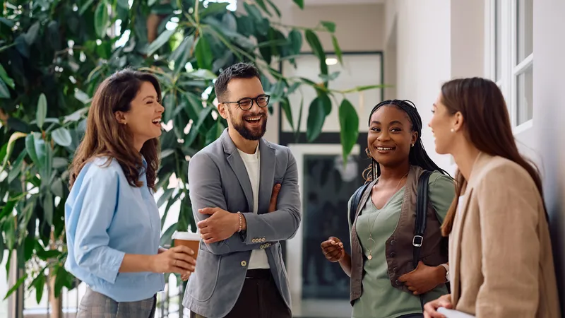 Happy,Business,Team,Communicating,On,A,Break,In,The,Office.