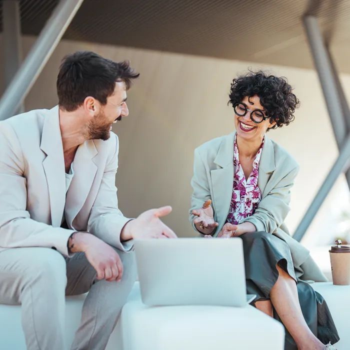 A,Businessman,And,A,Businesswoman,Engage,In,A,Work,Discussion