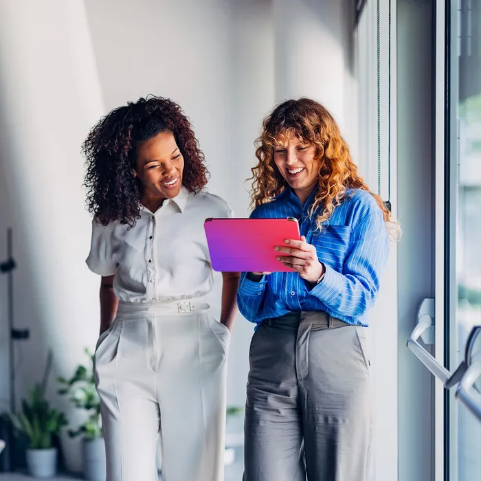 Two women with a device