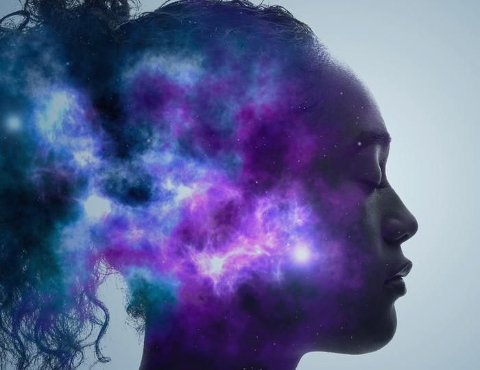 Blue and purple lights over a woman's head