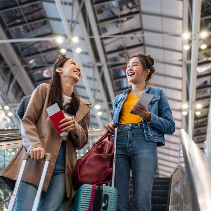 Asian,Young,Women,Passenger,Walk,In,Airport,Terminal,To,Boarding