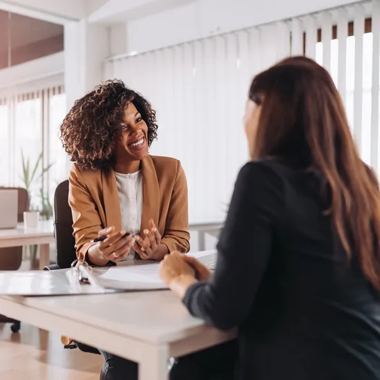Female client consulting with a agent in the office