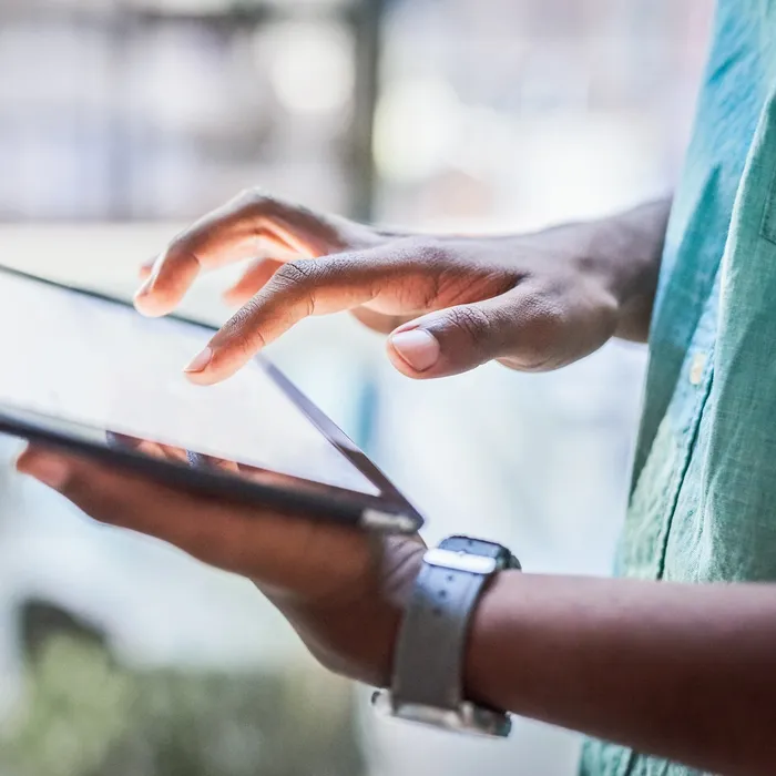 Closeup shot of an unrecognisable businessman using a digital tablet in an officeepam
