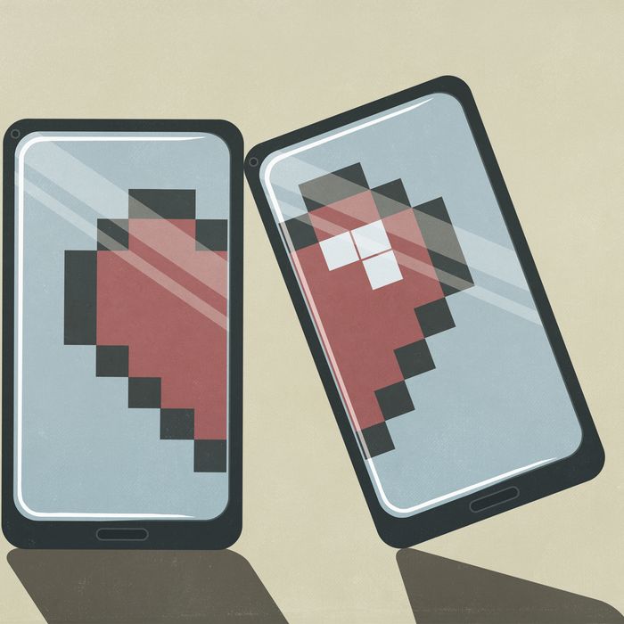 Pixelated broken heart on smart phone screens