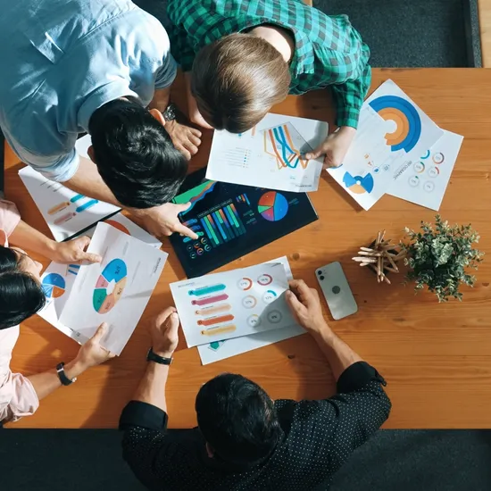 Top,Down,Aerial,View,Of,Smart,Business,People,Analyze,Data