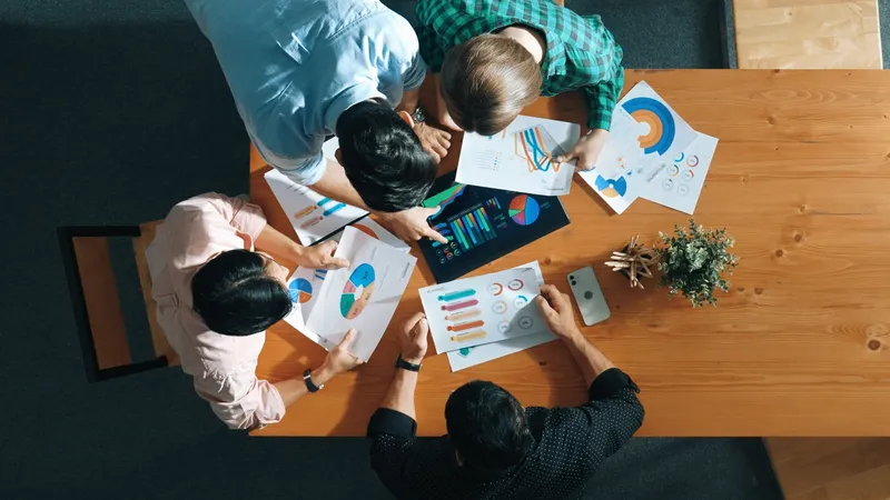 Top,Down,Aerial,View,Of,Smart,Business,People,Analyze,Data