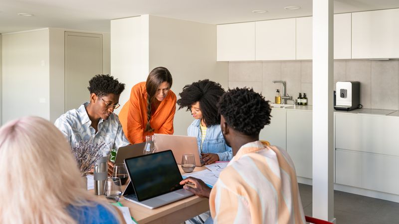 Group of people with laptops working