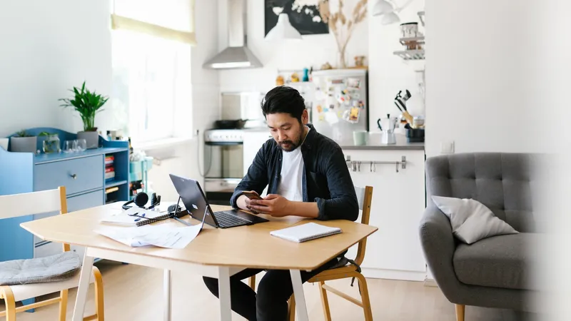 Photo series of japanese man working from home as a freelancer, making conference calls and discussing projects.