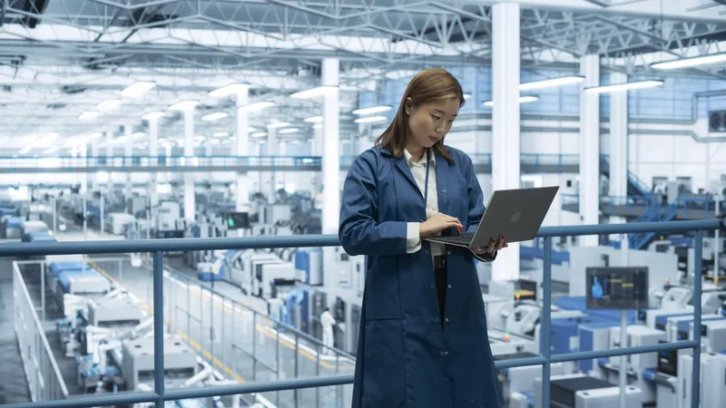 Electronics,Manufacturing,Technician,Working,On,A,Laptop,Computer,At,A