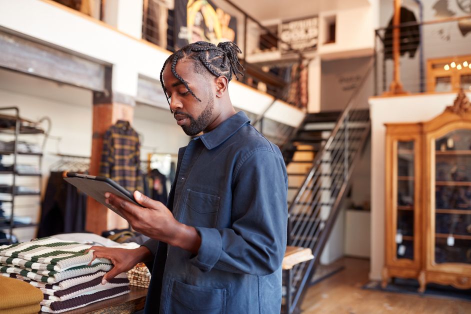 Male,Owner,Of,Fashion,Store,Using,Digital,Tablet,To,Check