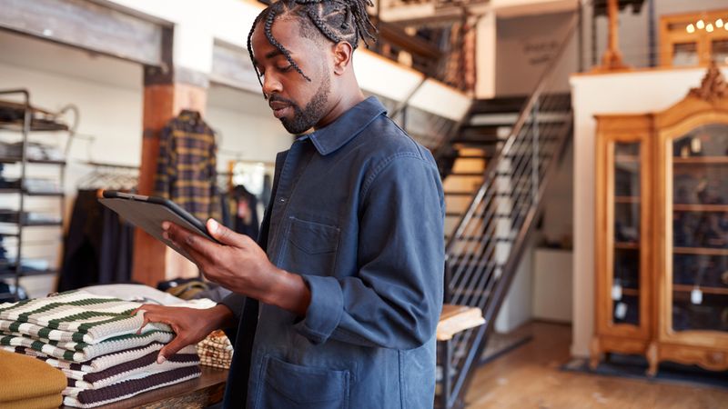 Male,Owner,Of,Fashion,Store,Using,Digital,Tablet,To,Check