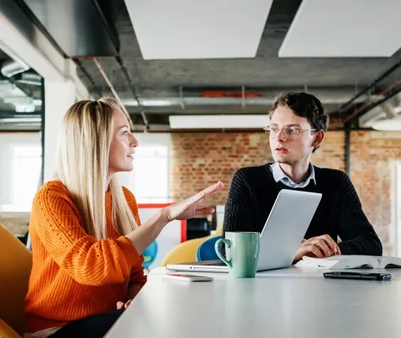 Man and woman having chat in the office