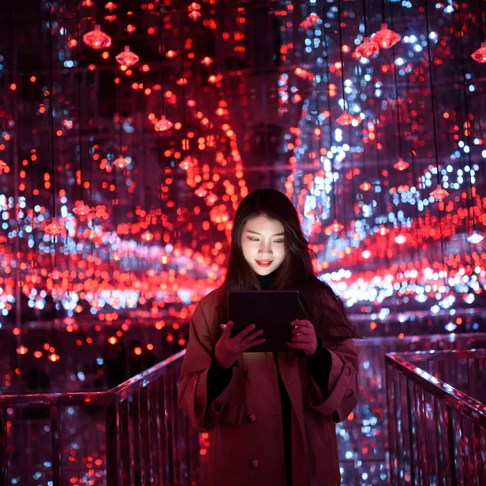 young aisan female using digital tablet