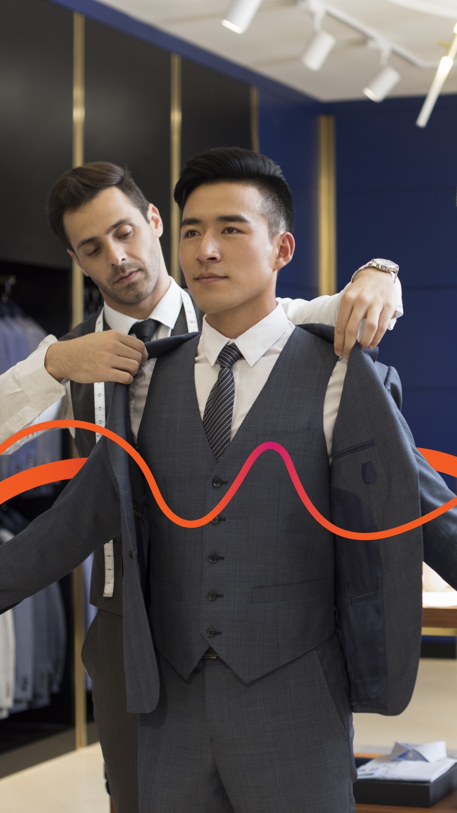 Businessmen trying a new suit in store