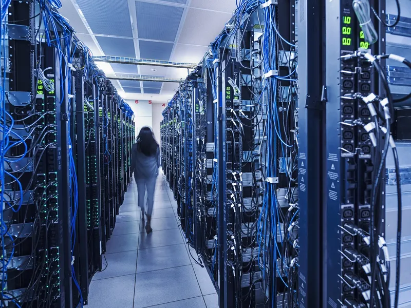 Woman walking in server room