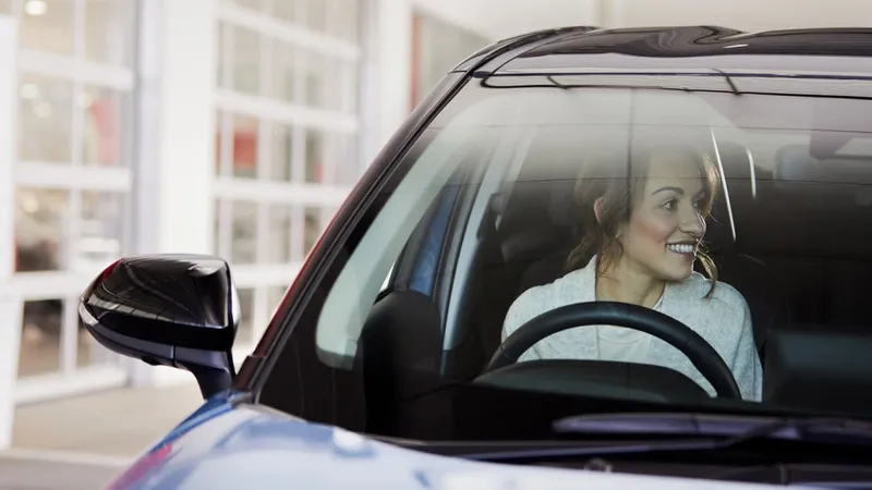 Woman in a Toyota car