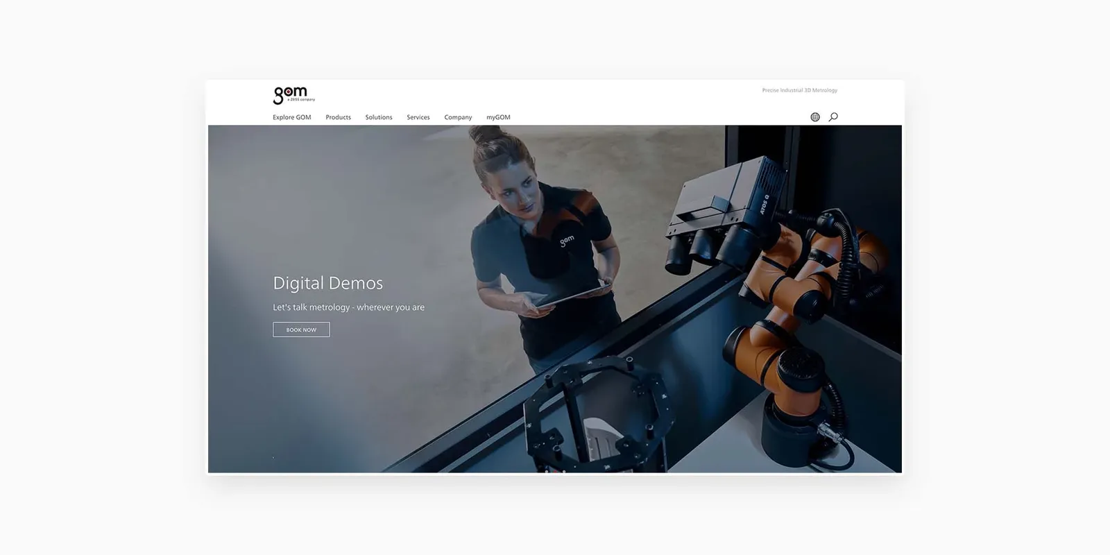 woman is looking at the robo-arm