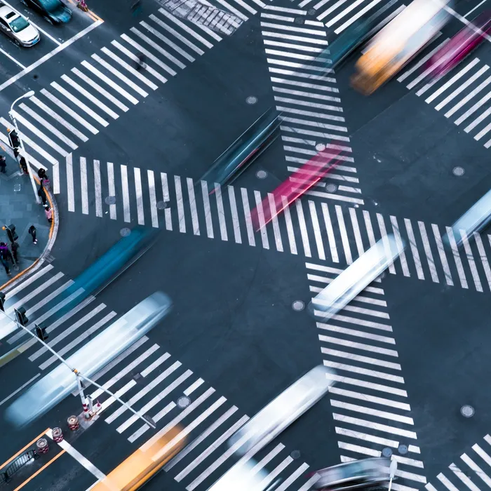 Blur motioin concept.Aerial view car move fast  on pedestrian crosswalk in modern city