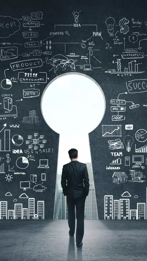 A businessman peeks through a keyhole, observing a keyhole with various business ideas written on it