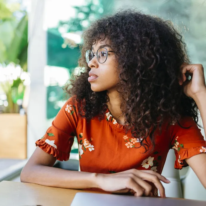 Portrait of a woman with glasses in a cafeColorful Human