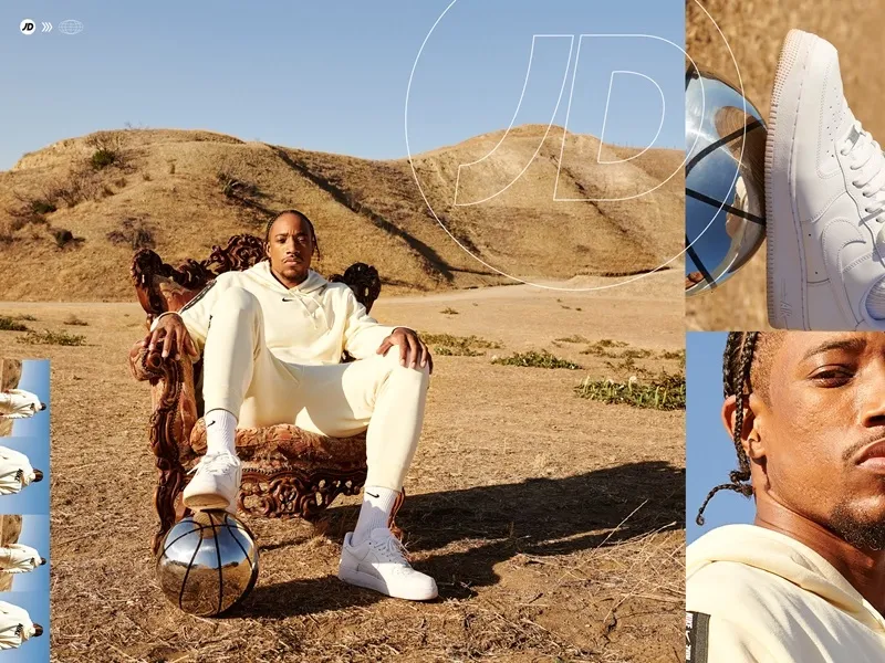 man sits in chair in the middle of desert