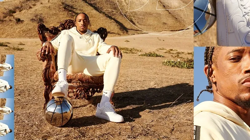 man sits in chair in the middle of desert