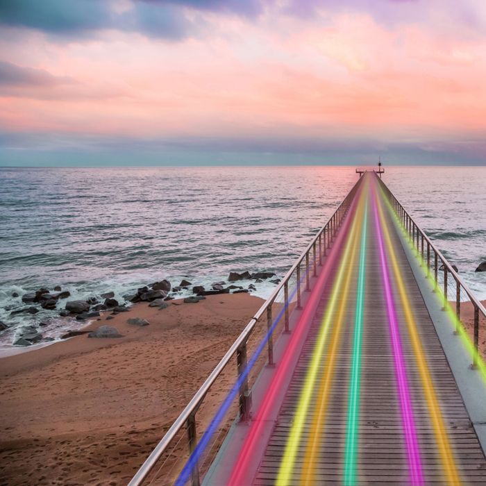 Walking in the Badalona pier of \ El Pont de Petroli\ a old pier for gas boats reconstructed for people to enjoy with panoramic view in the end of the bridge with stunning city views of Badalona and Barcelona, actually it was reformat after huge sea storm that damage the structure. Playing with lights in long exposure picture in a minimal and nice landscape over the beach.