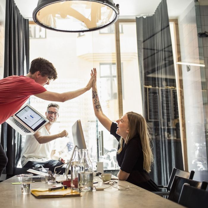 Successful team of new business people in creative office