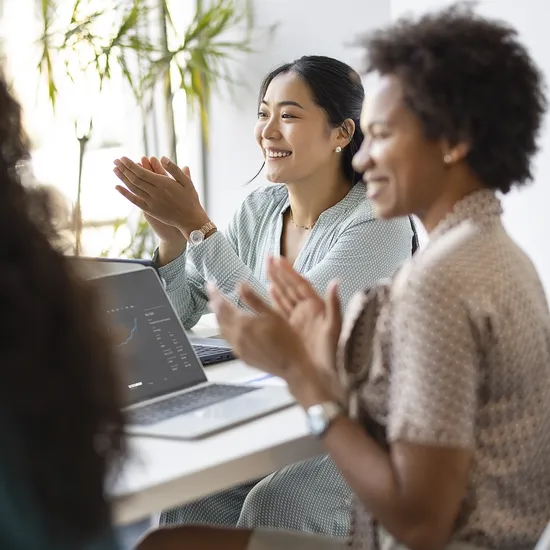 Successful business team is clapping their hands, celebrating the performance of new product